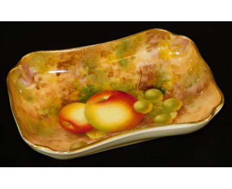 A Royal Worcester pin dish, by Frank Roberts, handpainted with autumnal fruits, grapes and apples, in a naturalistic setting,