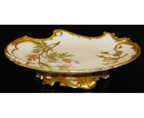 A Royal Worcester blush ivory low comport, decorated with flowers with a pierced rim, shape code 1426, 1891, 22cm Dia.  There