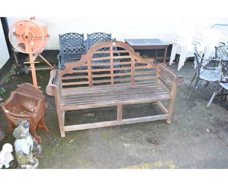 A slatted hardwood garden bench