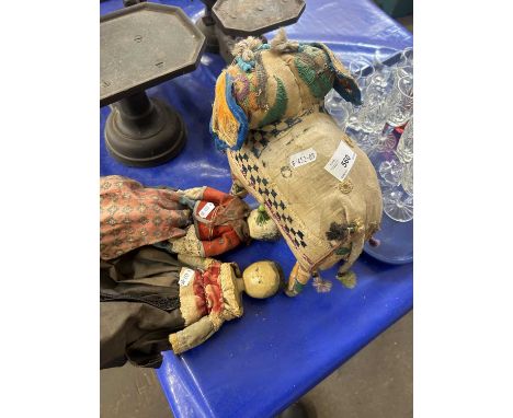 Two small Folk Art dolls together with a vintage fabric covered model elephant