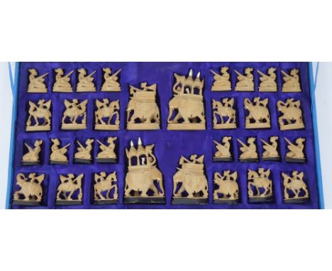 A Vintage Hand-Carved Indian Chess Set, the set having individual carved pieces depicting various animals; horses, camels, el