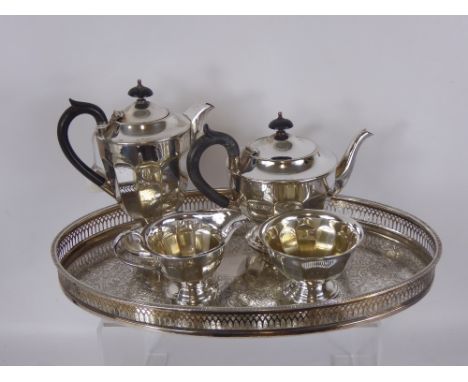 A Sheffield Plate Tea Set, comprising teapot, coffee pot, sugar bowl, milk jug, on galleried tray, together with a pair of so