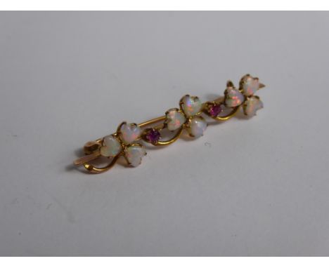 A Lady's 9 ct Gold Opal and Ruby Brooch, 2 x 2.15 ruby, 3.5 mm opals .approx 2 gms,