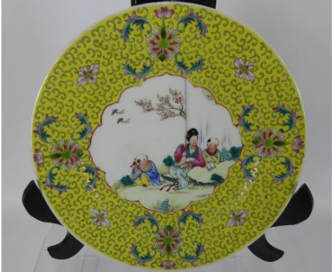 A Pair of 20th Century Chinese Plates, the plates depicting characters in a garden, approx 25 cms dia, together with a blue a