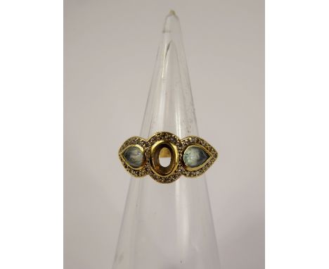 A Lady's 18 ct Yellow Gold Aquamarine and Diamond Ring, approx 40 pts of 8 cuts dias, 2 x aqua 6.4 mm , centre stone missing,