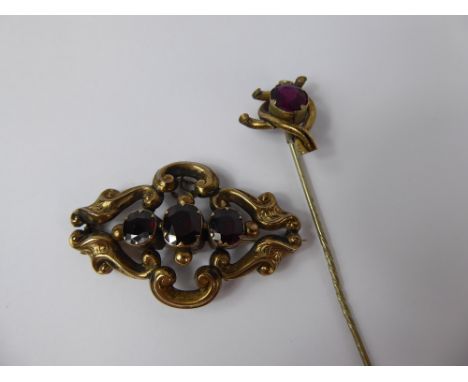 A Victorian 9 ct Gold Tested, Three Stone Garnet Brooch, garnet 1 x 8.6 mm, 2 X 7 x 6 mm, together with a gentleman's 9 ct st