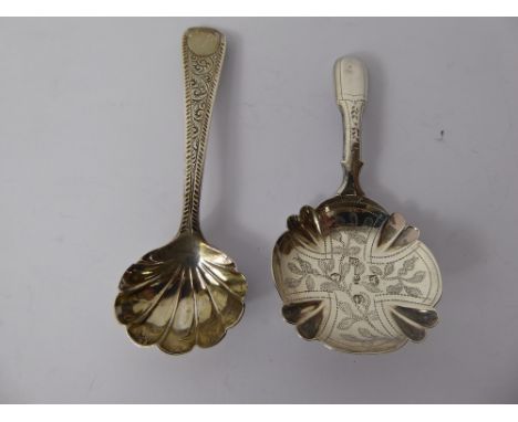 A Georgian Silver Caddy Spoon, Birmingham hallmark, dated 1824 mm Bettridge together with a Georgian silver spoon London date