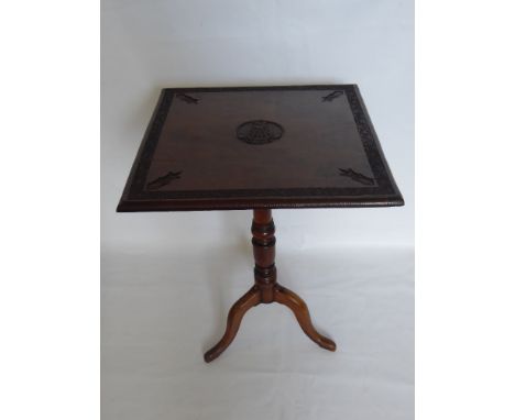 An Oak Tilt Top Table Inscribed Duke of Connaught, the table having carved with floral  border, insignia to each corner, carv