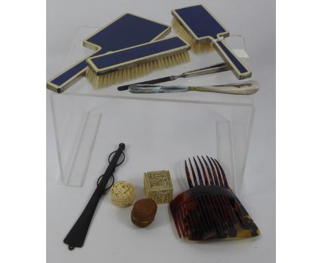 A Chrome and Enamel Dressing Table Set, comprising hair brush, mirror, clothes brush, shoe horn, nail file together with tort