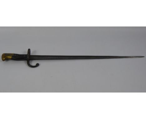 A French 19th Century Military Bayonet, engraved St Etienne Armory stamped 1881 nr 3957, standard pattern with wood and brass