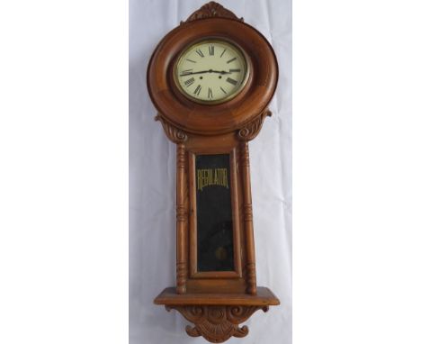 A Vintage American Style Pine Regulator Wall Clock, with white face, Roman numerals, carved finials to top and base, approx 2