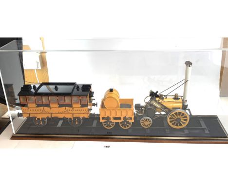 Hornby Stephensons Rocket Real Steam Train Set 3.5" gauge model in large display case on track, 38" long x 8.5" wide x 16" hi