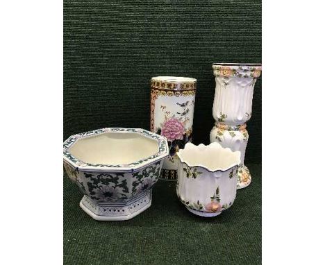 A decorative jardiniere on stand, oriental stick stand and a planter 