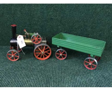 A Mamod live steam engine with trailer