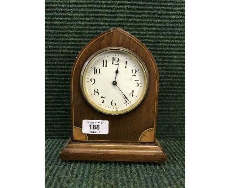 An inlaid mahogany arched topped mantel clock 
