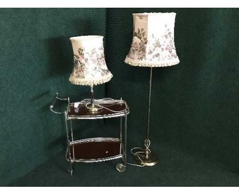 A two tier trolley, brass standard lamp and brass table lamp 