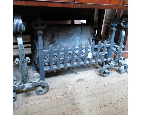An antique style fire back, dated 1679, fire basket, spark guard and fire tools