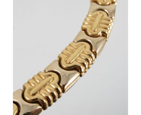 A collar, tagged '750', of patterned panel links, 9mm wide, to a hidden box clasp, weight 51.3g gross