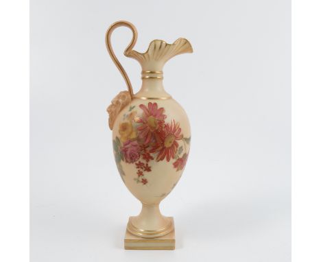 A Royal Worcester blush ivory ewer, decorated with flowers. with moulded mask to the handle and raised on a pedestal with squ