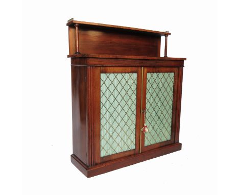 A 19th century rosewood chiffonier, with a galleried shelf over and two doors with brass grills, width 41ins   Condition repo