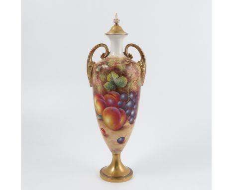 A Royal Worcester covered pedestal vase, decorated to the front with fruit to a mossy ground by Freeman, with gilt cover, pai