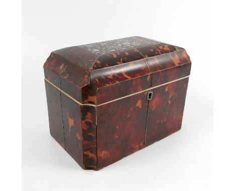 A 19th century tortoiseshell tea caddy, of rectangular form with canted corners, the top inlaid with floral mother of pearl, 