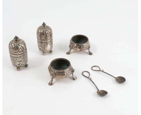 A pair of silver open salts, embossed with scrolls and flowers, raised on three scroll feet, London 1862, weight 2oz, togethe