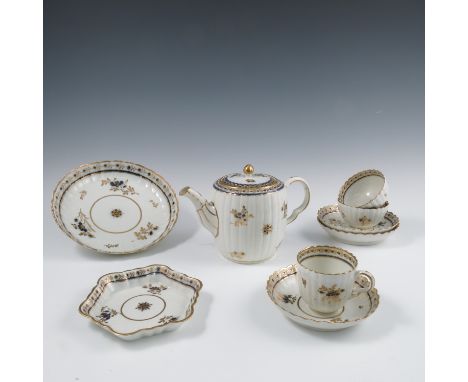 A 19th century Caughley tea service, comprising teapot, eight tea bowls, eight tea cups, seven saucers, a slop bowl, two cake