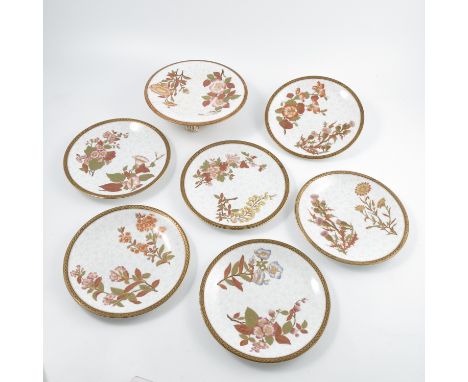 A late 19th century Royal Worcester dessert service, comprising twelve plates and a low comport, decorated with floral sprays