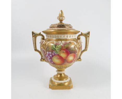 A Royal Worcester porcelain pierced covered pedestal vase, decorated with plums, raspberries, apples and grapes to a mossy gr