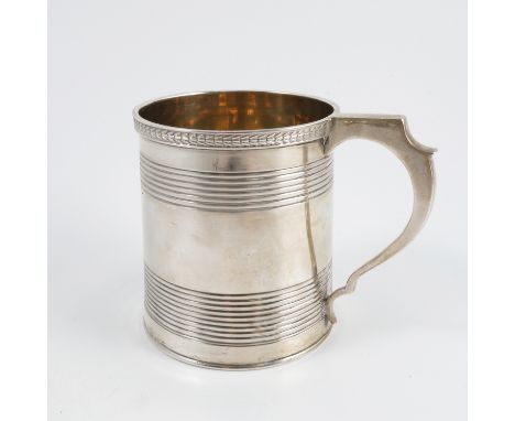 A Georgian silver mug, with gilt wash interior and ribbed body, London 1821, weight 6oz