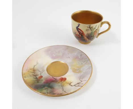 A Royal Worcester cabinet cup and saucer, decorated with a peacock on a branch by Powell, af, dated 1920   Condition report: 