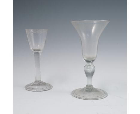 A collection of 18th and 19th century glassware, to include a glass with flared bowl, knopped stem with air bubble on a folde