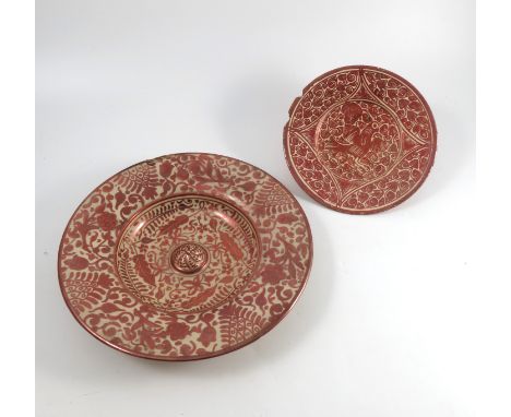 A late 17th/early 18th Century Hispano-Moresque pottery lustre plate decorated to the centre with a bird within a circle of f