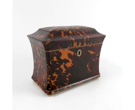 A 19th century tortoiseshell tea caddy, of rectangular form with canted corners, having ivory inlay and raised on mother of p