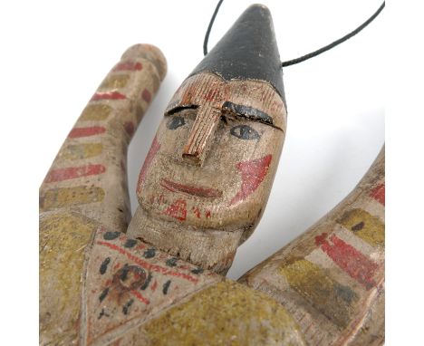 A painted pine articulated model, of a harlequin, with carved and painted features, height 13ins   Condition report:  Scuffs 