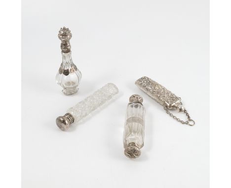 A 19th century silver and glass double ended scent bottle, with faceted body, the silver ends with embossed decoration, toget