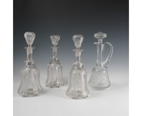 Three 19th century mallet shaped glass decanters, together with a glass claret jug   Condition report:  One decanter stopper 