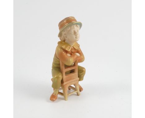 A Royal Worcester shot silk figure, of a boy in Victorian dress seated on a chair, model number 916, dated 1899, height 4ins 