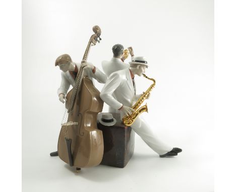 A Lladro model, of three jazz musicians, playing a double base, a saxophone and as trumpet, af, height 15ins   Condition repo