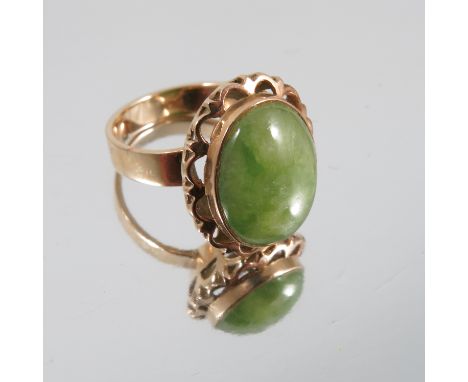 A single stone jade ring, stamped '14k', finger size N 1/2, weight 6.4g gross