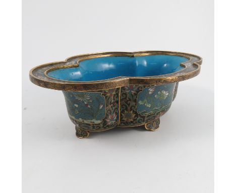 An early 20th Century enamel cloisonne and gilt metal quarter lobed bowl, the enamelled turquoise interior to a gilt metal bo