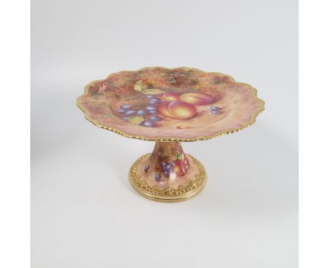 A Royal Worcester comport, decorated with fruit to a mossy background by Freeman, with shaped gilt edge, diameter 8.75ins   C