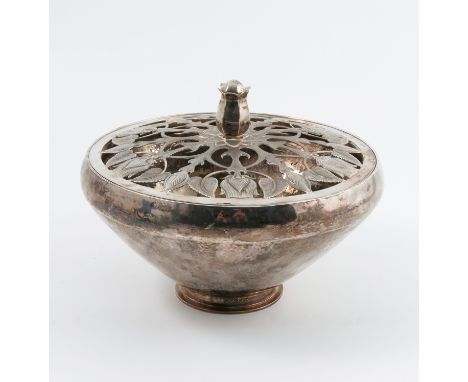 A 20th century silver centrepiece, the circular bowl with hammered finish, the pierced cover decorated with flower buds, with