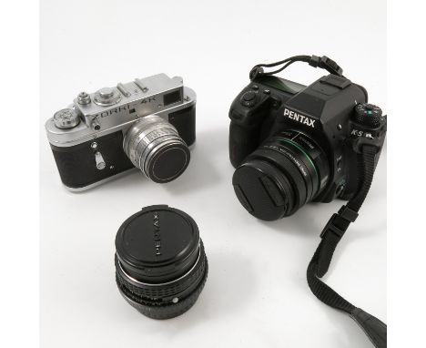 A collection of cameras, to include Nikon F-400 camera, Samsung GX10 camera, a Minolta camera, Canon A-1 etc, together with l