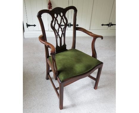 An 18th century Chippendale design mahogany armchair, with pierced back, serpentine front rail and H stretcher   Condition re