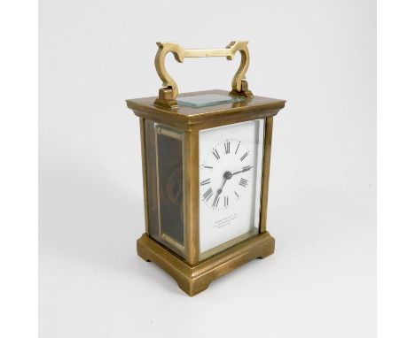 A brass cased carriage clock, the rectangularly enamel dial marked Hamilton & Co Ltd, height including handle 6ins