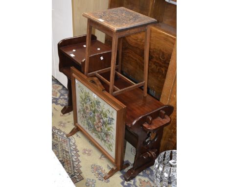 An early 20th century jardiniere stand, the top moulded with fruiting vine; a firescreen inset with a floral embroidery; a te