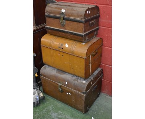 Three vintage tin trunks
