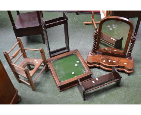 A Victorian mahogany dressing mirror; an Edwardian mahogany mirror; an oak stick stand; an oak book trough; a child's chair a